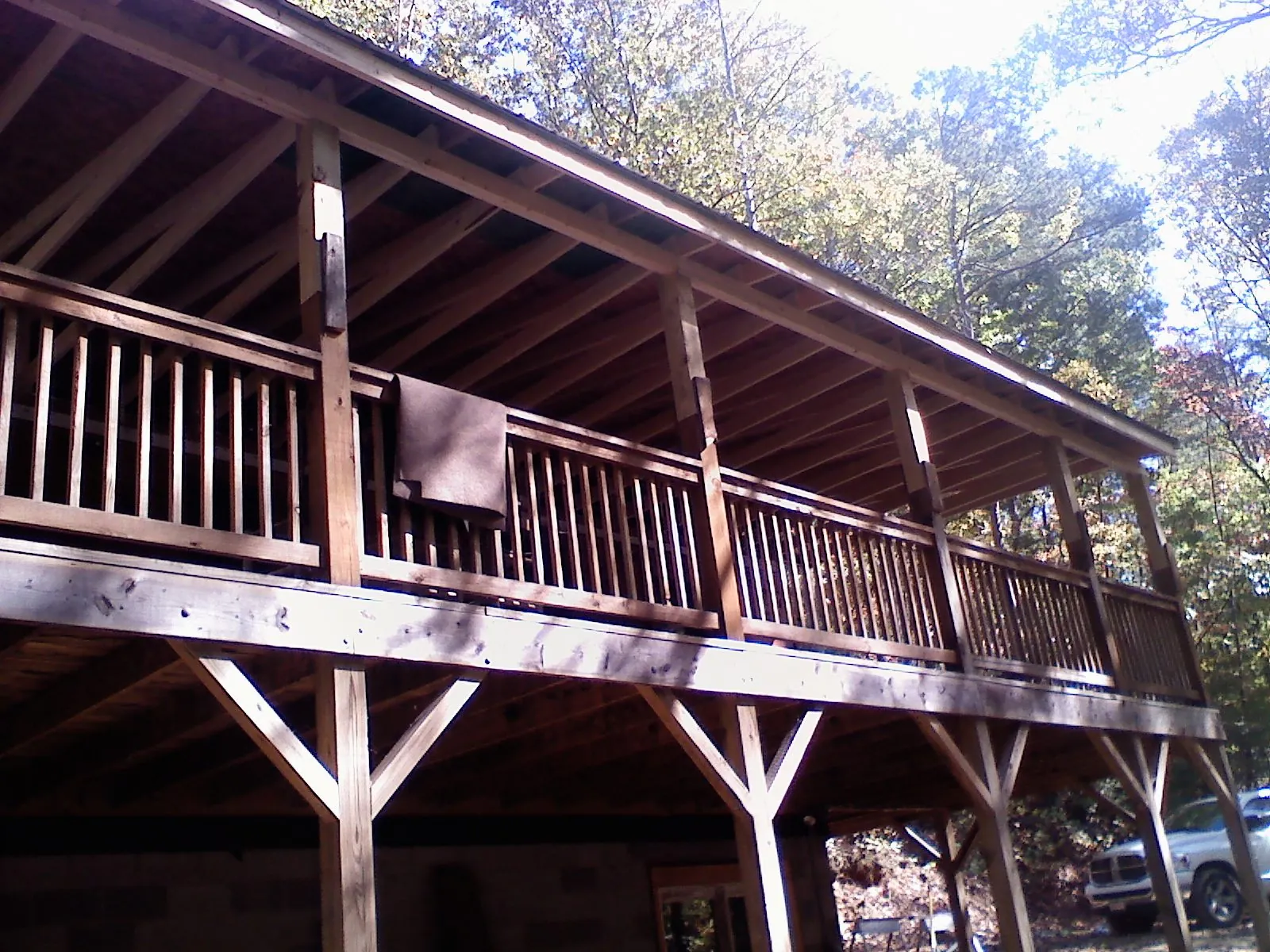 Timber framing under a new elevated porch and deck — Roof Leak Repair in Three Lakes by Roofing Brothers
